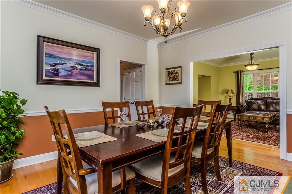 437 Vanderveer Road Raritan, NJ 08869 - Photo 10 of 25 a view of a dining room with furniture a chandelier and wooden floor