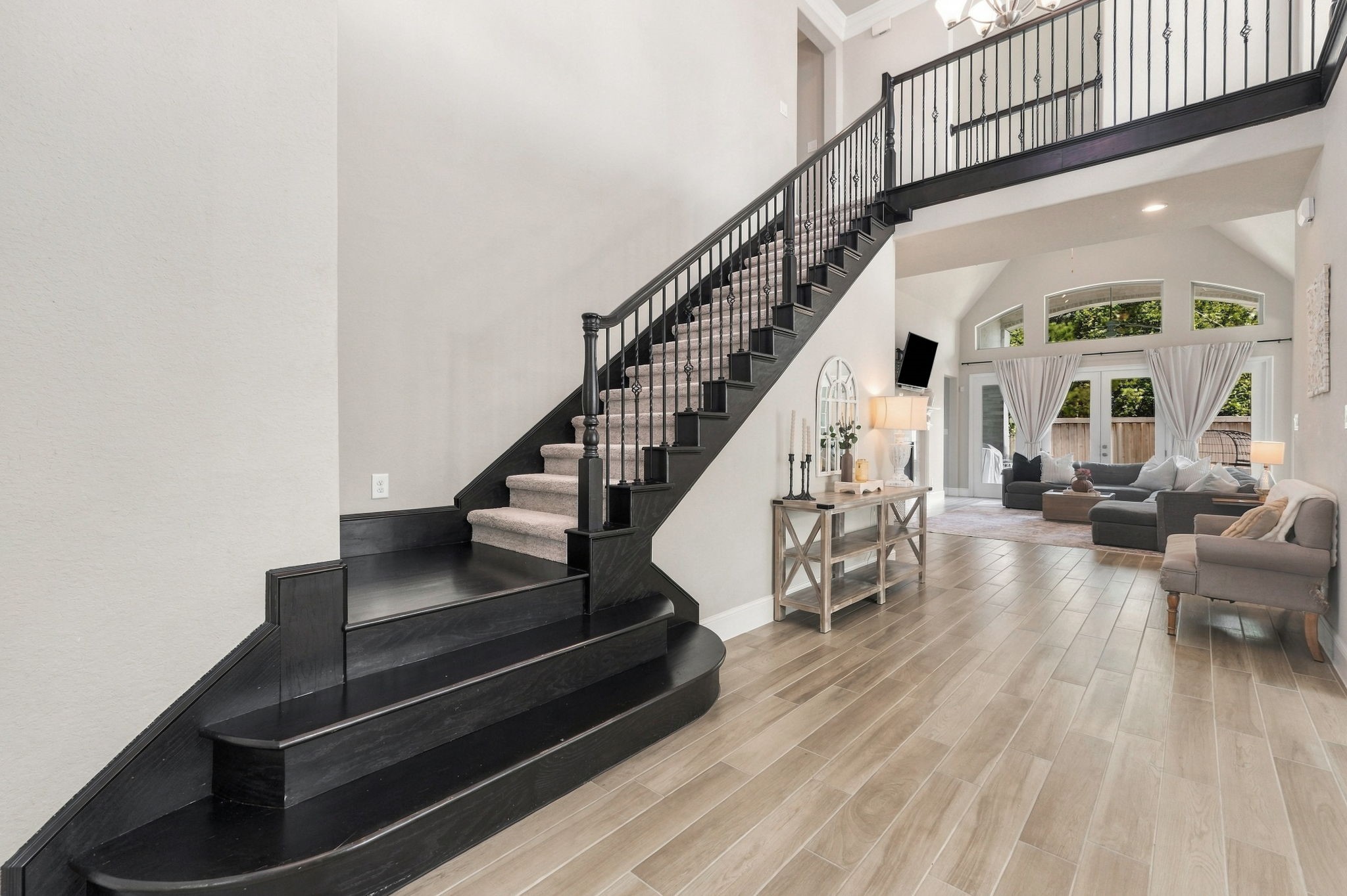 26910 Selinsgrove Road Magnolia, TX 77354 - Photo 7 of 47 Sightlines extend through the main level, giving the entry an open, connected feel. The staircase becomes an architectural focal point as you move farther into the home.