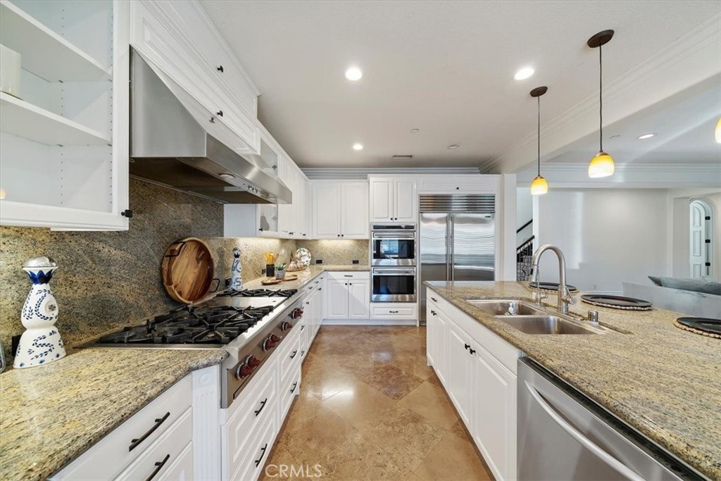 9 Waltham Road Ladera Ranch, CA 92694 - Photo 18 of 68 a large kitchen with stainless steel appliances granite countertop a stove a sink and a granite counter tops