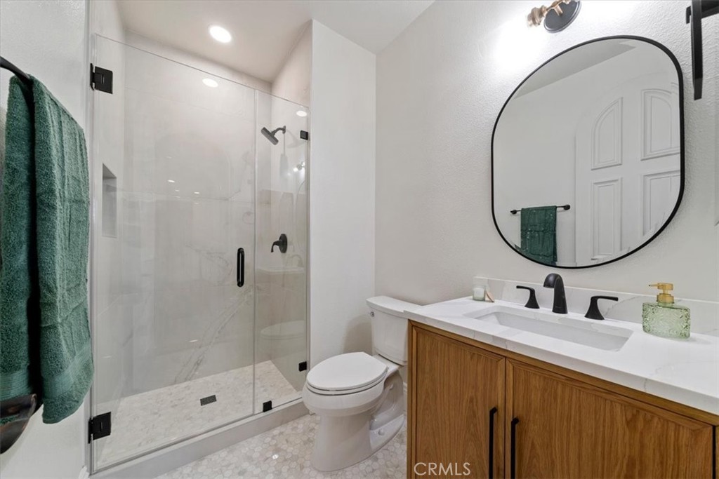 9 Waltham Road Ladera Ranch, CA 92694 - Photo 39 of 68 a bathroom with a sink a toilet and a mirror