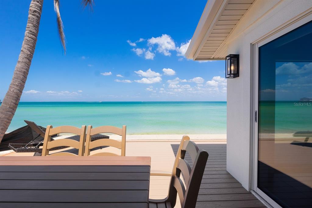 306 South Bay Boulevard Anna Maria, FL 34216 - Photo 7 of 44 a view of a balcony with two chairs