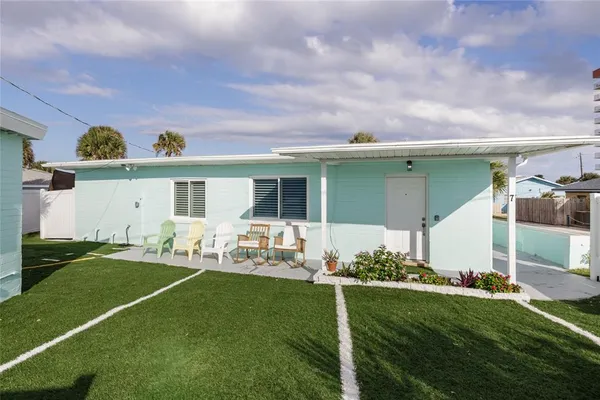 a view of a livingroom with furniture and a flat screen tv