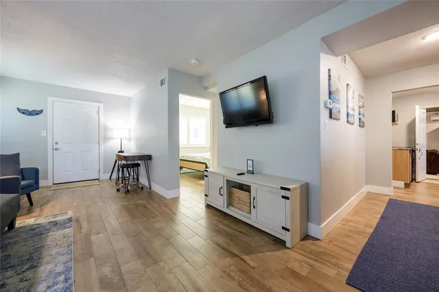 a bedroom with a bed and a chair