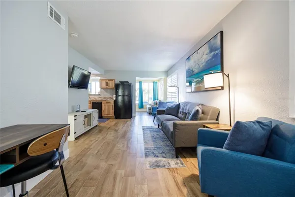 a bathroom with a double vanity sink mirror and toilet