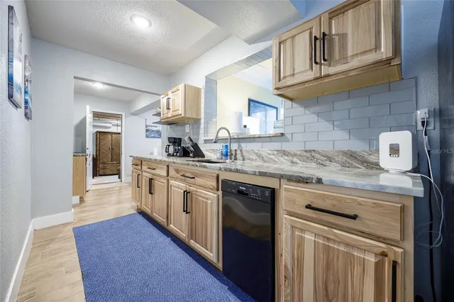 a view of dining room and cabinets