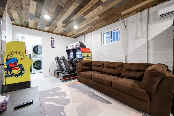 a bedroom with a bed and a tv on the dresser