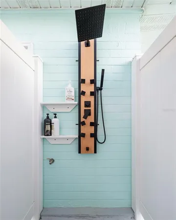 a bathroom with a tub and a shower