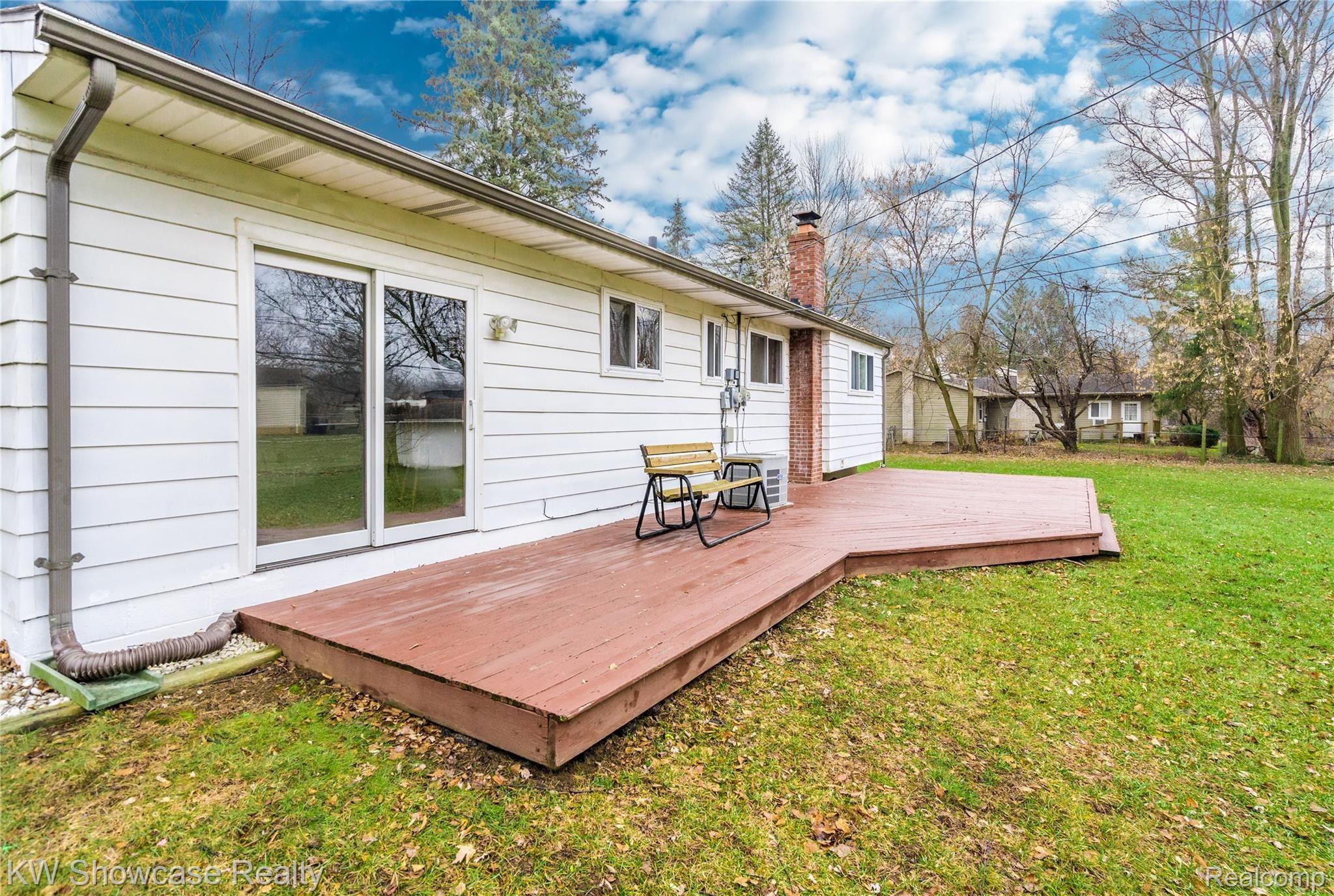 2129 Welch Road Walled Lake, MI 48390 - Photo 8 of 26 The expansive deck is large enough to enjoy outdoor living.