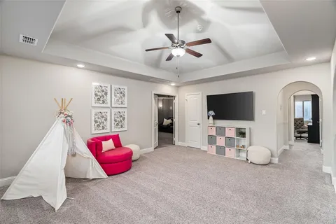 a view of a livingroom with furniture and a flat screen tv