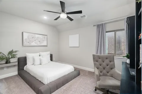 a bedroom with a large bed and a couch