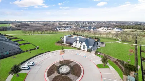 an aerial view of a house with outdoor space and lake view