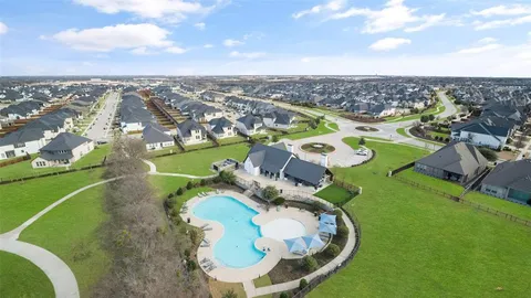 an aerial view of a house with outdoor space