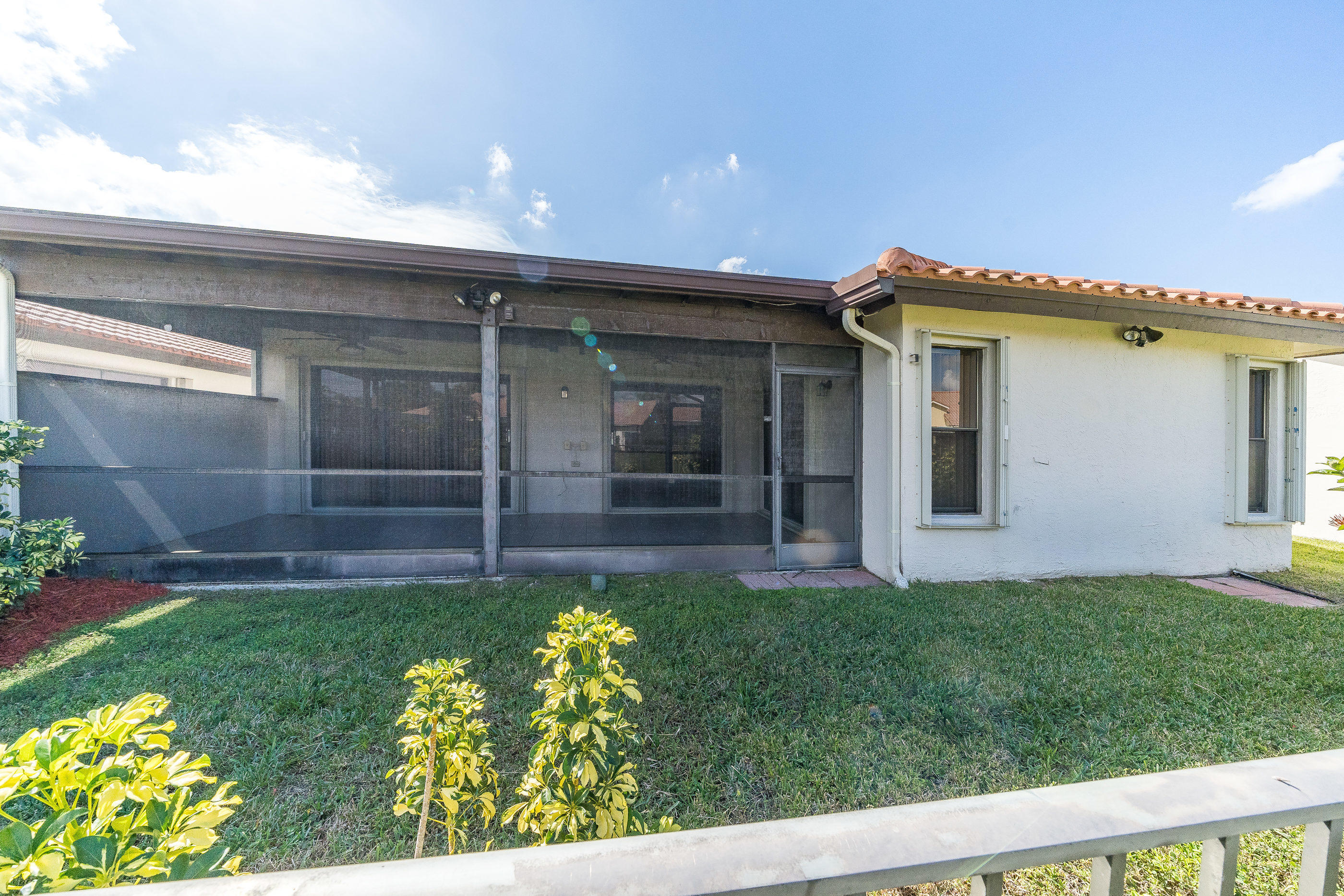 7723 Solimar Circle Boca Raton, FL 33433 - Photo 32 of 40 a view of a house with a yard and a garden