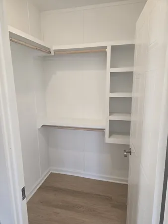a view of an empty walk in closet