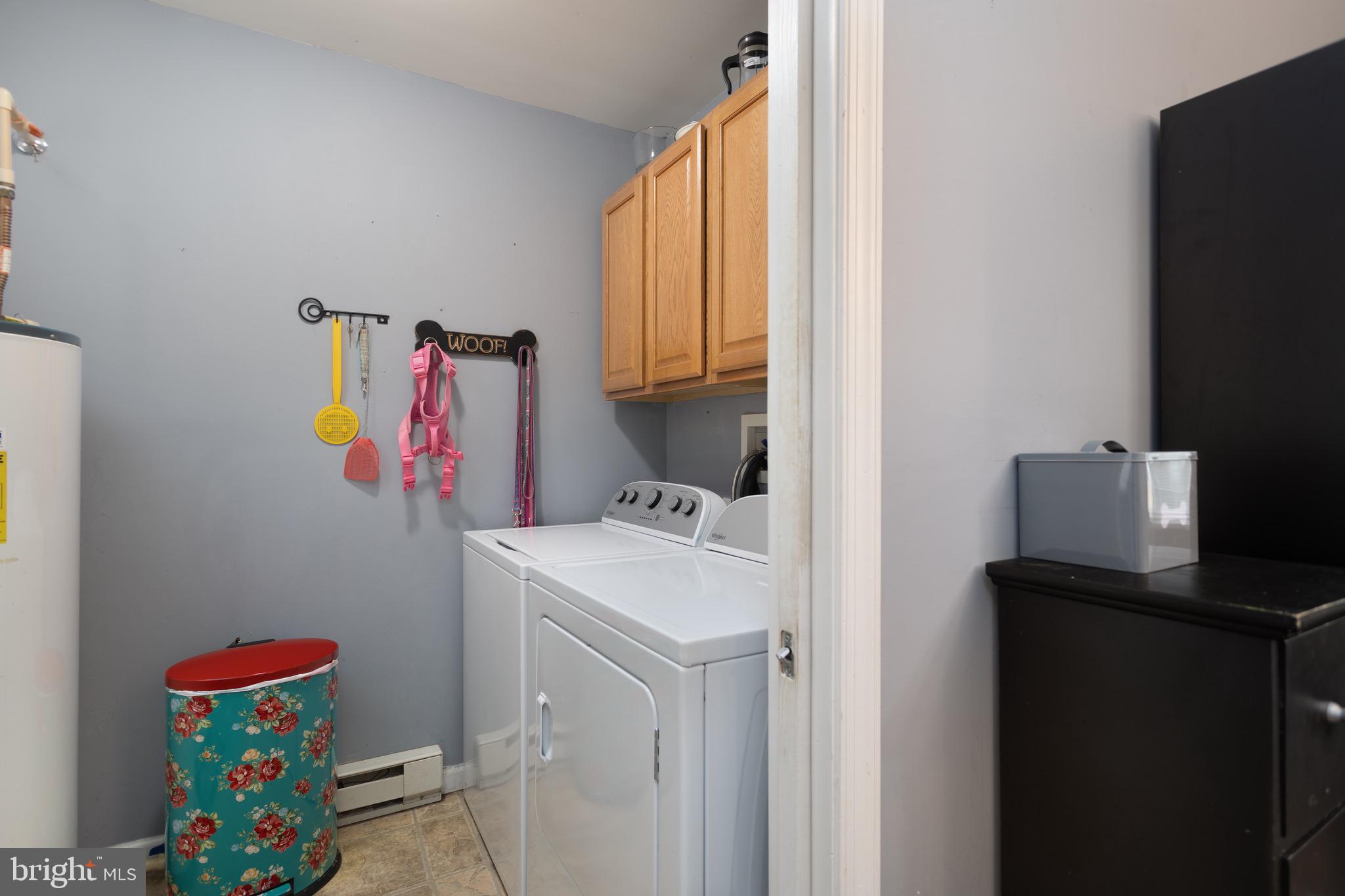 1303 Colonial Avenue Cambridge, MD 21613 - Photo 6 of 12 a storage room with dryer and washer
