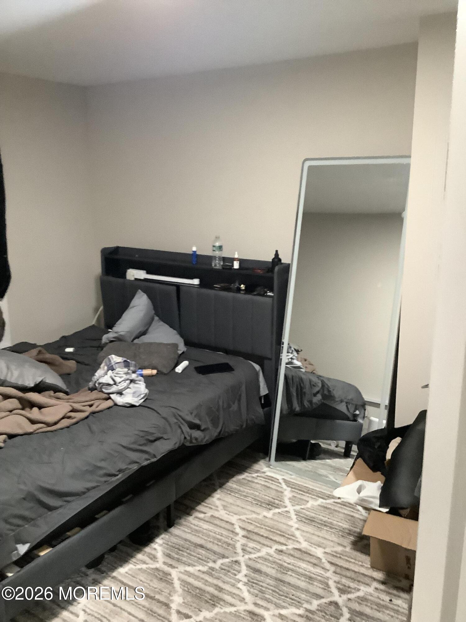 242 1st Street Keyport, NJ 07735 - Photo 17 of 23 a bedroom with a bed and a window