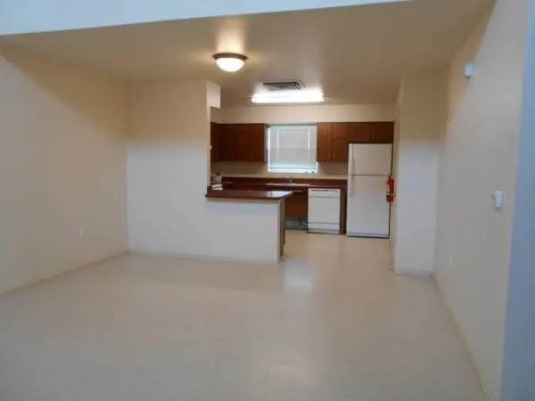 a kitchen with a sink cabinets and stainless steel appliances