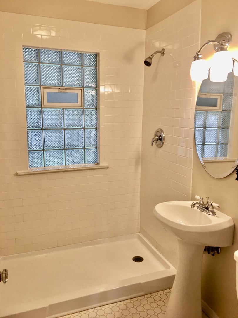 719 North County Line Road Hinsdale, IL 60521 - Photo 7 of 12 a bathroom with a sink and a mirror