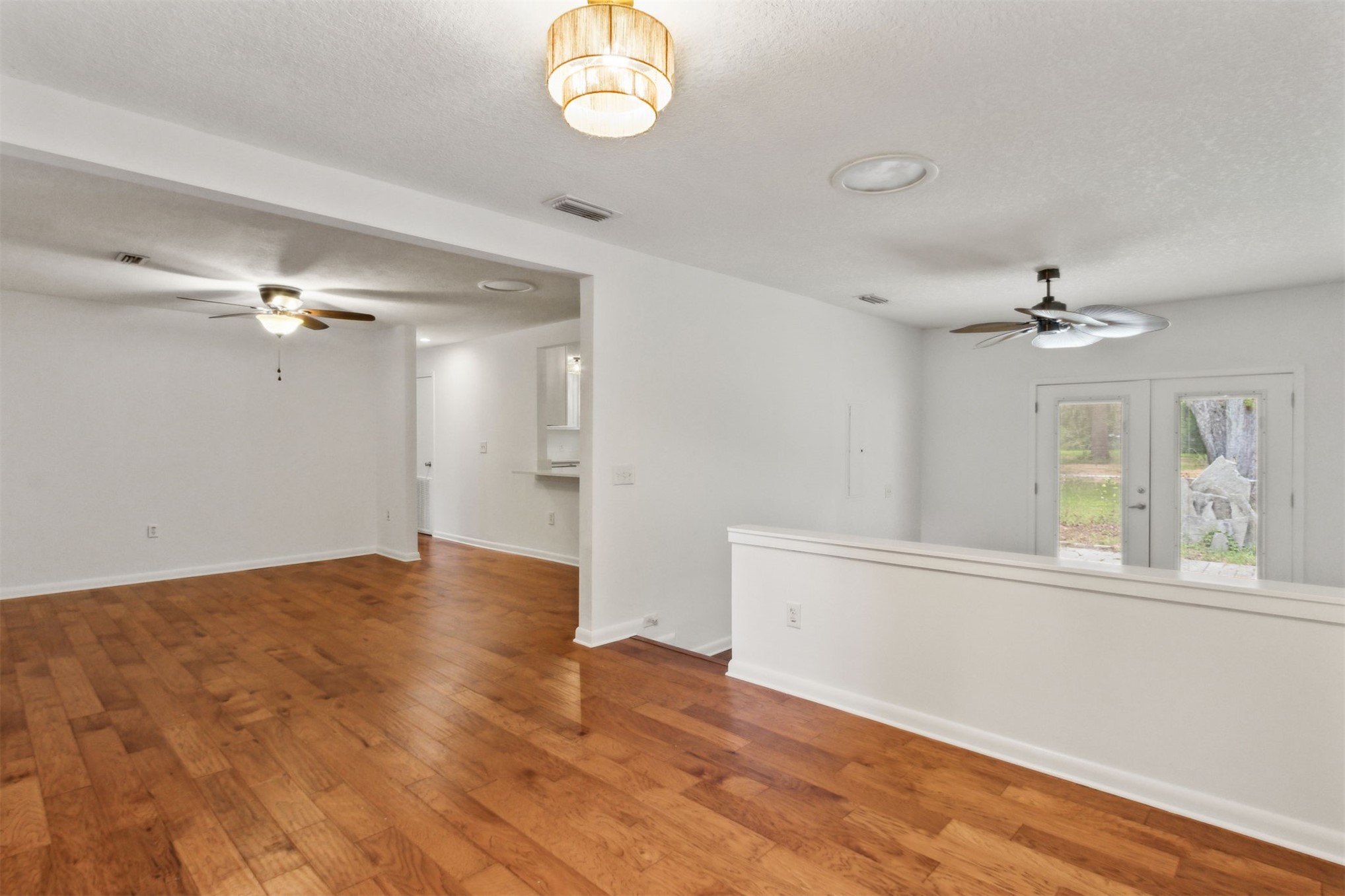 2441 Amelia Road Fernandina Beach, FL 32034 - Photo 20 of 36 wooden floor in an empty room with a window