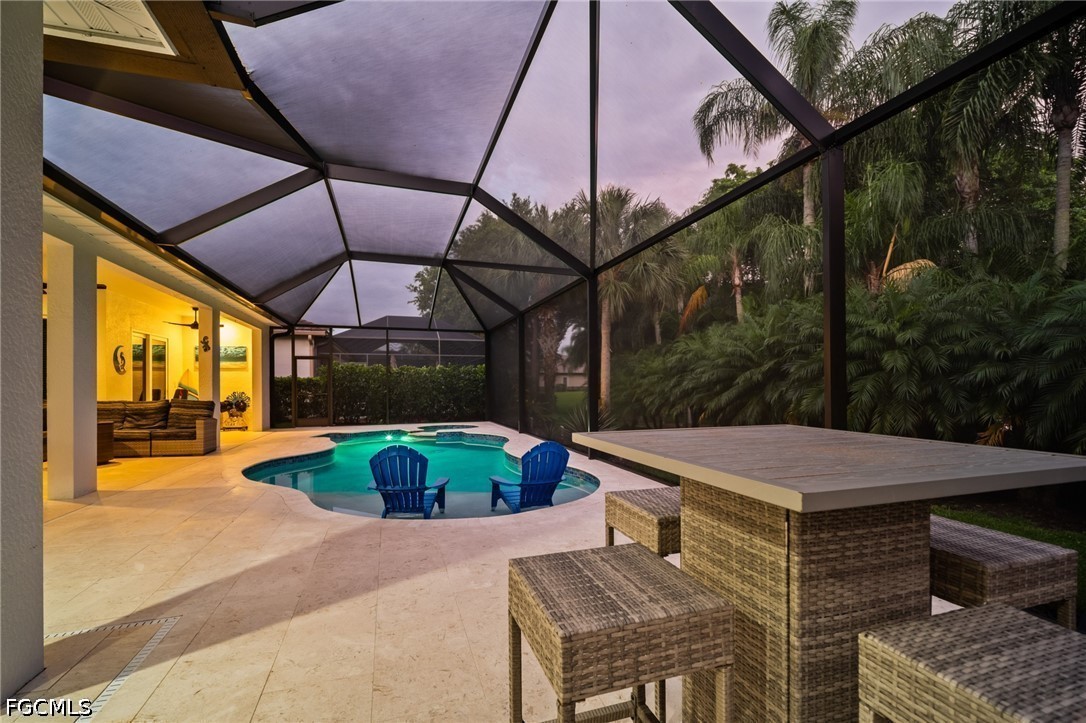 9042 Bronco Court Naples, FL 34113 - Photo 31 of 50 a outdoor space with patio