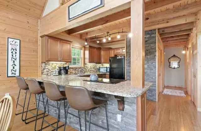 a kitchen with a table and chairs in it