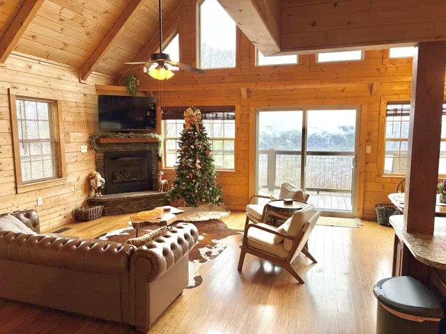 a living room with furniture fireplace and flat screen tv