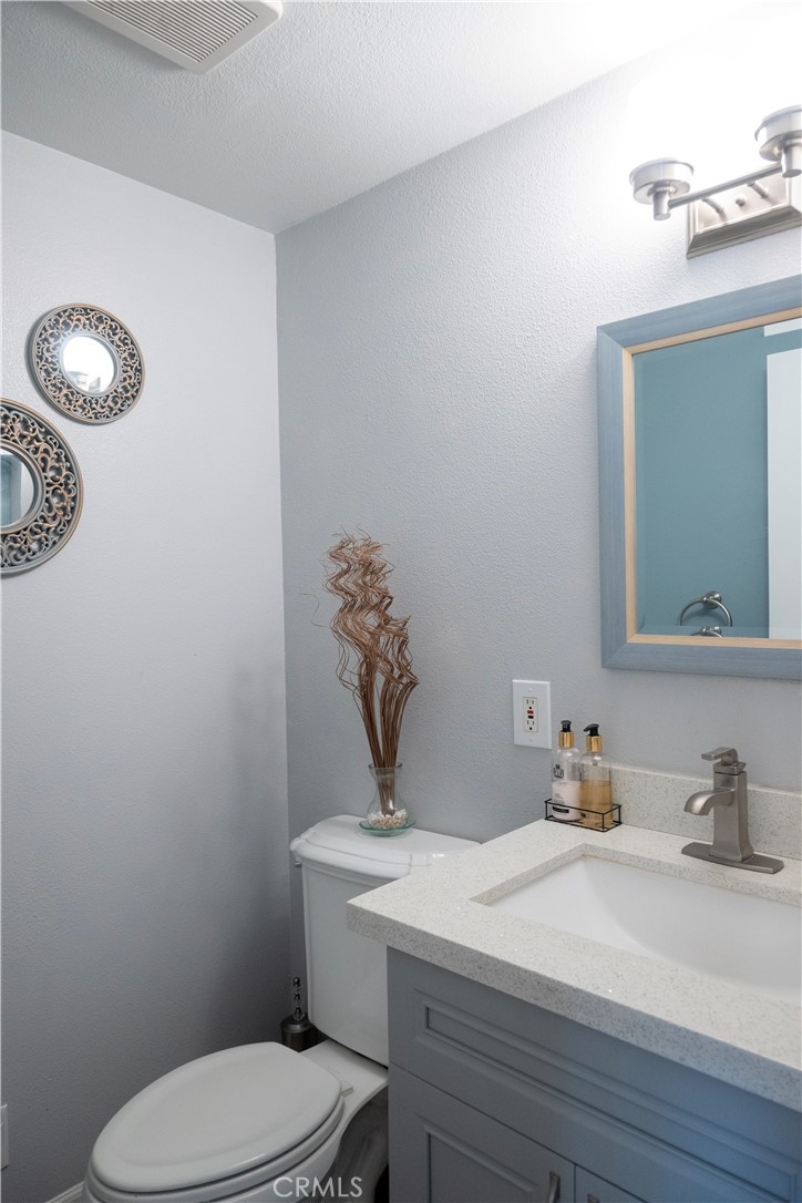 1320 Zeus West Covina, CA 91790 - Photo 15 of 39 a bathroom with a toilet a sink and mirror