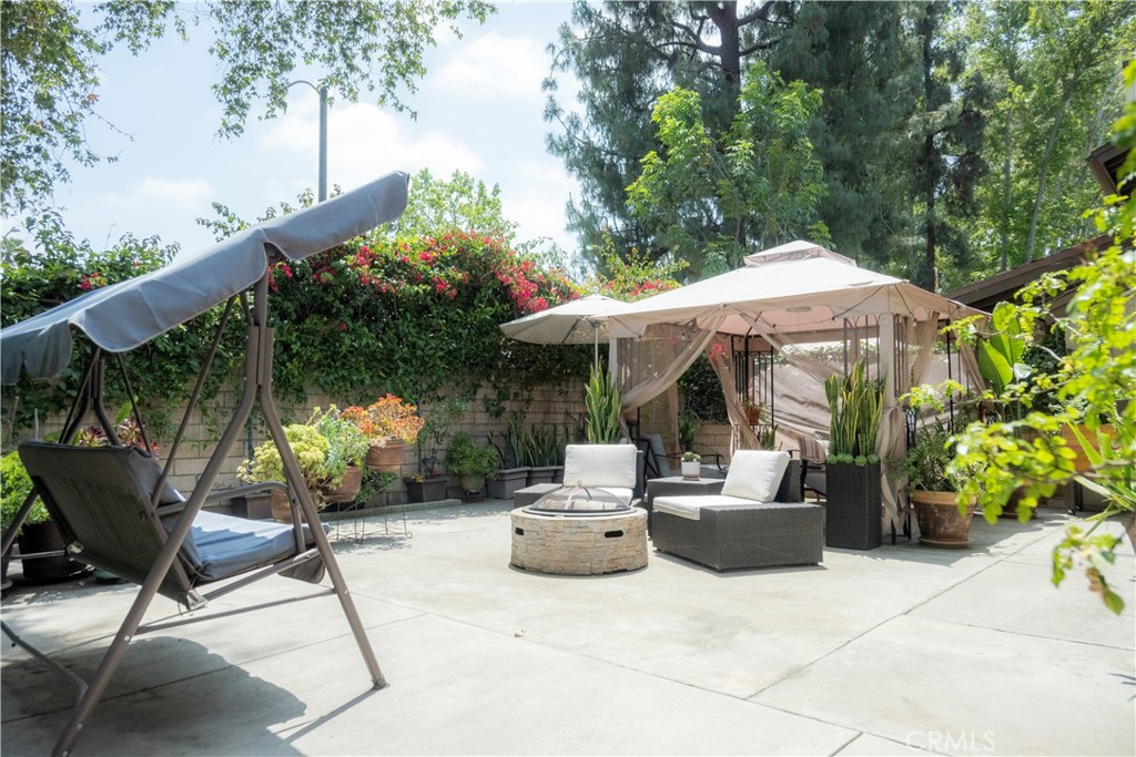 1320 Zeus West Covina, CA 91790 - Photo 20 of 39 a view of a patio with table and chairs and potted plants