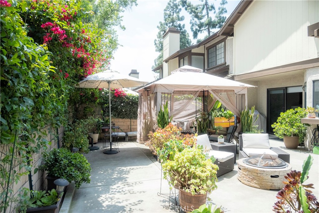 1320 Zeus West Covina, CA 91790 - Photo 21 of 39 a view of a patio with table and chairs potted plants