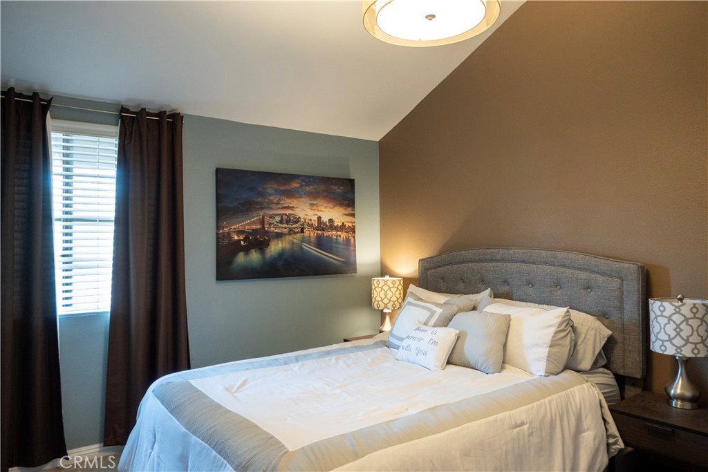 1320 Zeus West Covina, CA 91790 - Photo 22 of 39 a bedroom with a bed and a painting on the wall