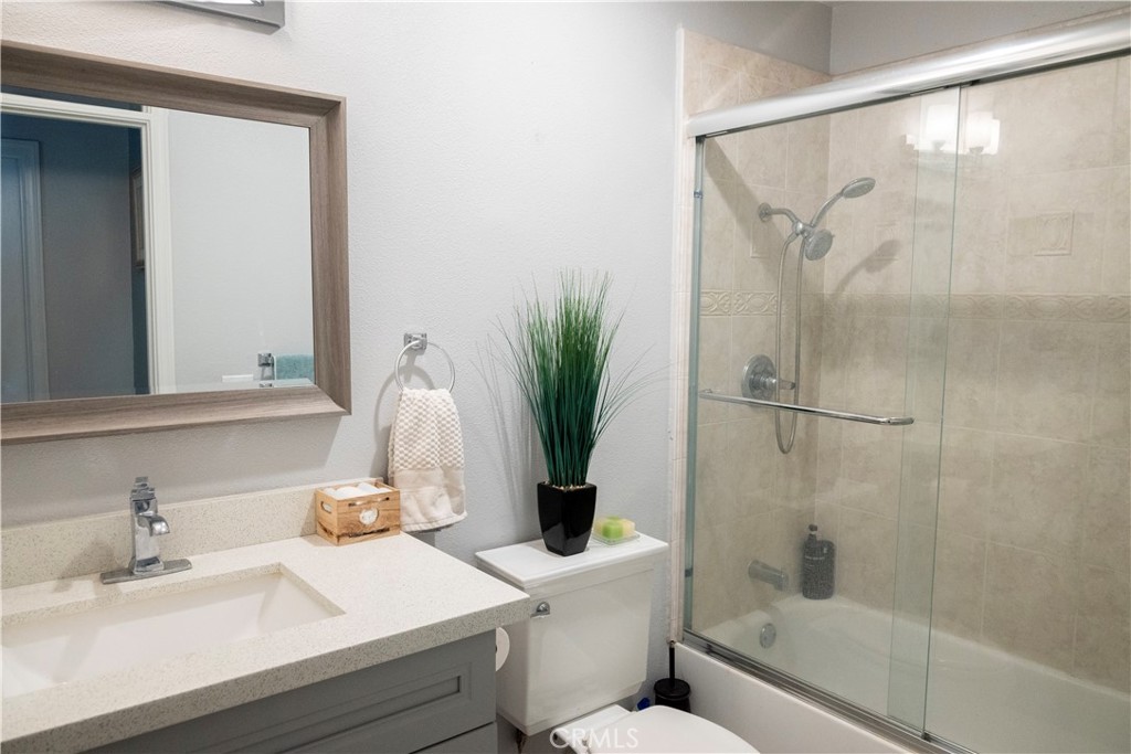 1320 Zeus West Covina, CA 91790 - Photo 24 of 39 a bathroom with a sink a toilet and a mirror