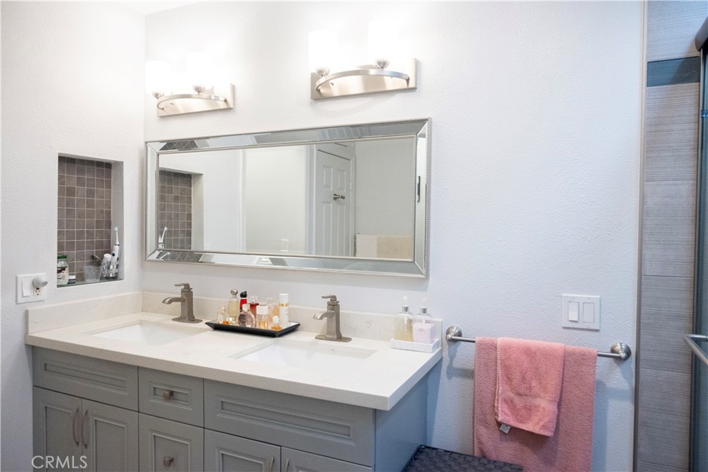 1320 Zeus West Covina, CA 91790 - Photo 30 of 39 a bathroom with a sink vanity and mirror