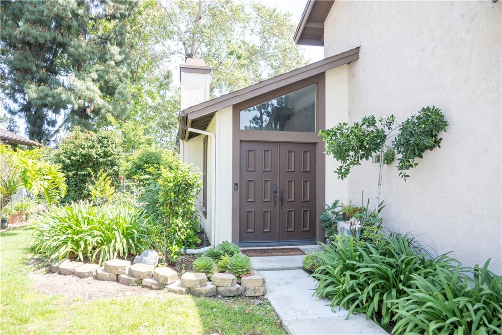 1320 Zeus West Covina, CA 91790 - Photo 3 of 39 a couple of flower plants in front of door