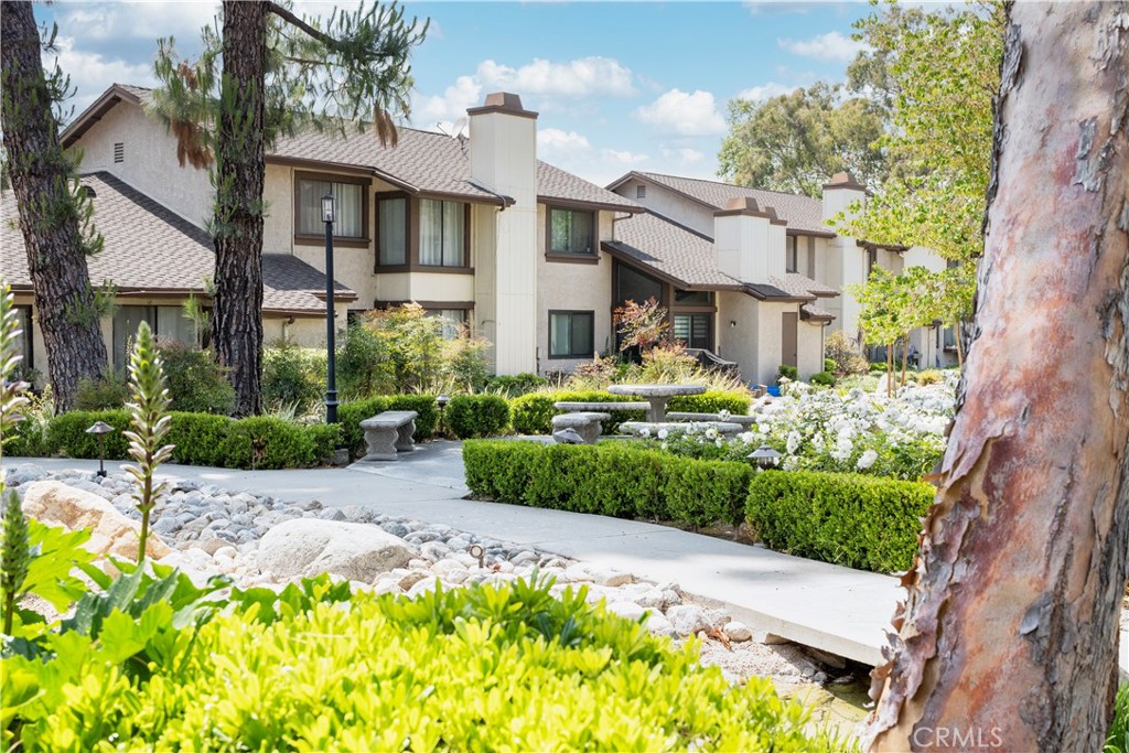 1320 Zeus West Covina, CA 91790 - Photo 32 of 39 a front view of a house with a garden