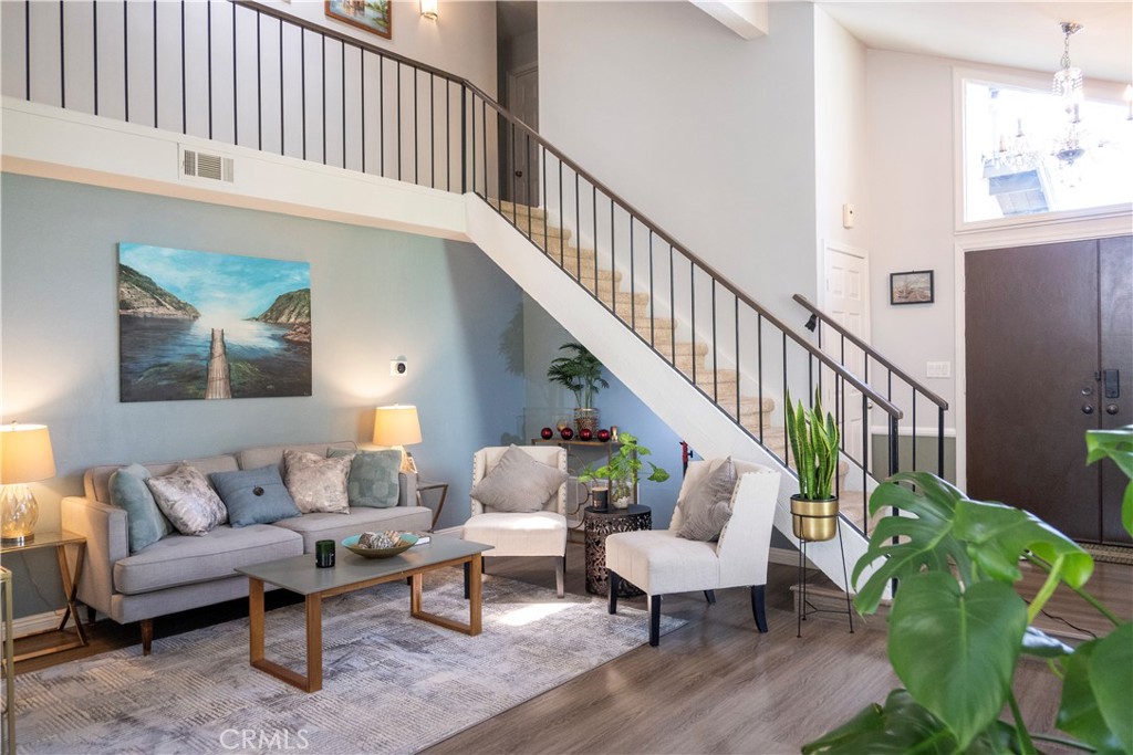 1320 Zeus West Covina, CA 91790 - Photo 8 of 39 a living room with furniture and a wooden floor
