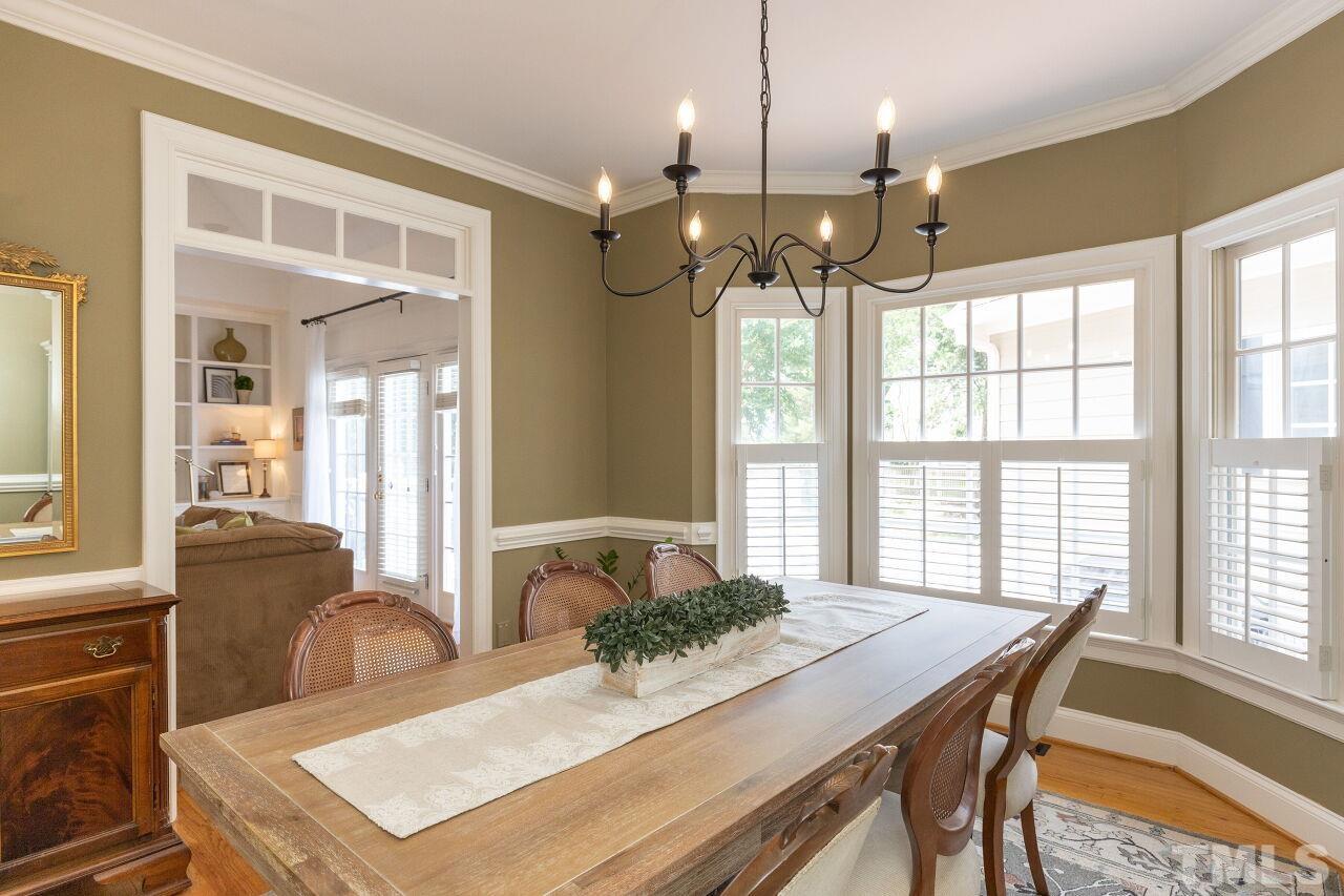 107 Quarter Path Cary, NC 27518 - Photo 12 of 29 a view of a dining room with furniture window and outside view