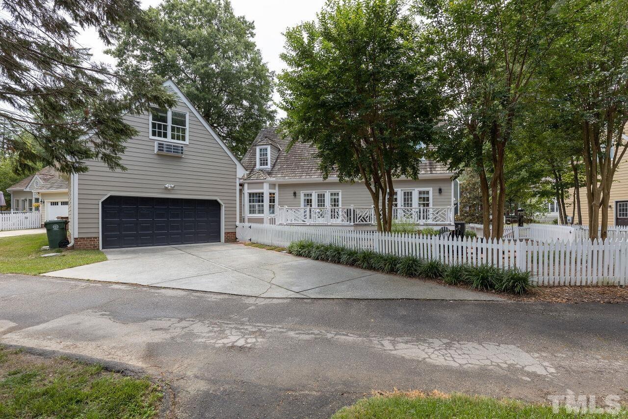 107 Quarter Path Cary, NC 27518 - Photo 29 of 29 a front view of a house with a yard and garage