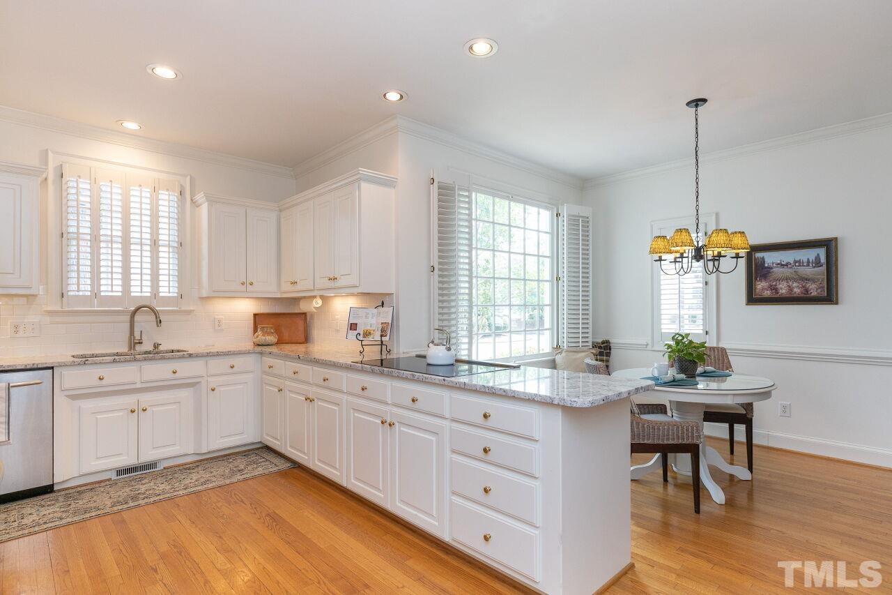 107 Quarter Path Cary, NC 27518 - Photo 7 of 29 a kitchen with a sink stove and cabinets