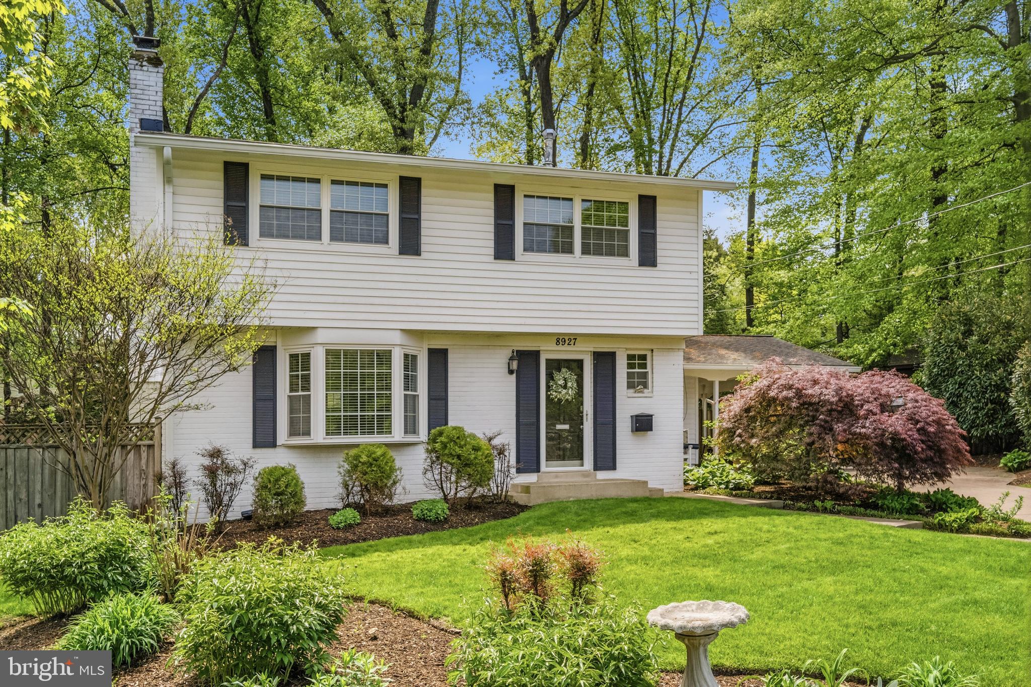 8927 Cromwell Drive Springfield, VA 22151 - Photo 5 of 20 a view of a house with a yard and potted plants