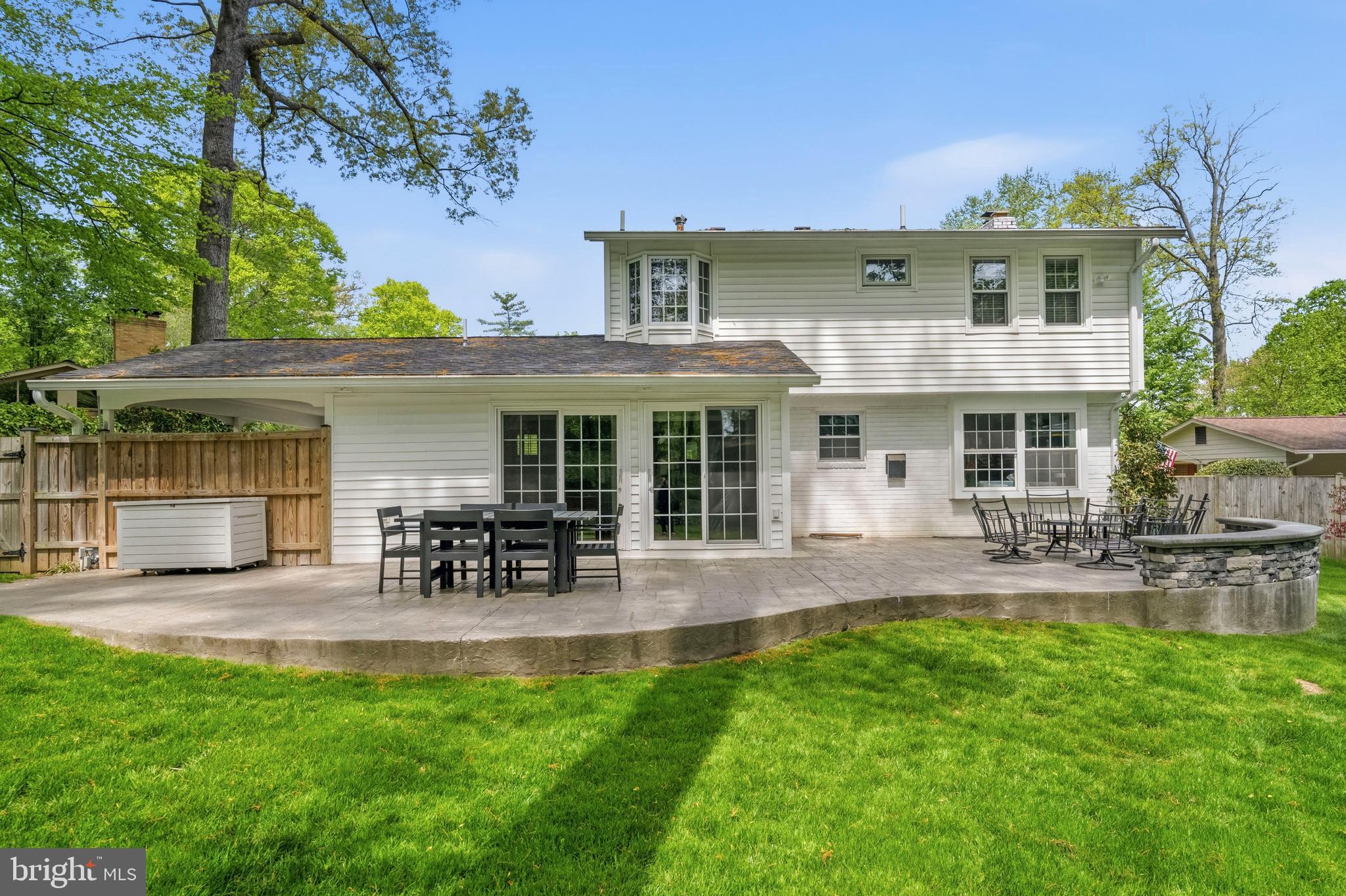 8927 Cromwell Drive Springfield, VA 22151 - Photo 7 of 20 a front view of house with a garden and patio