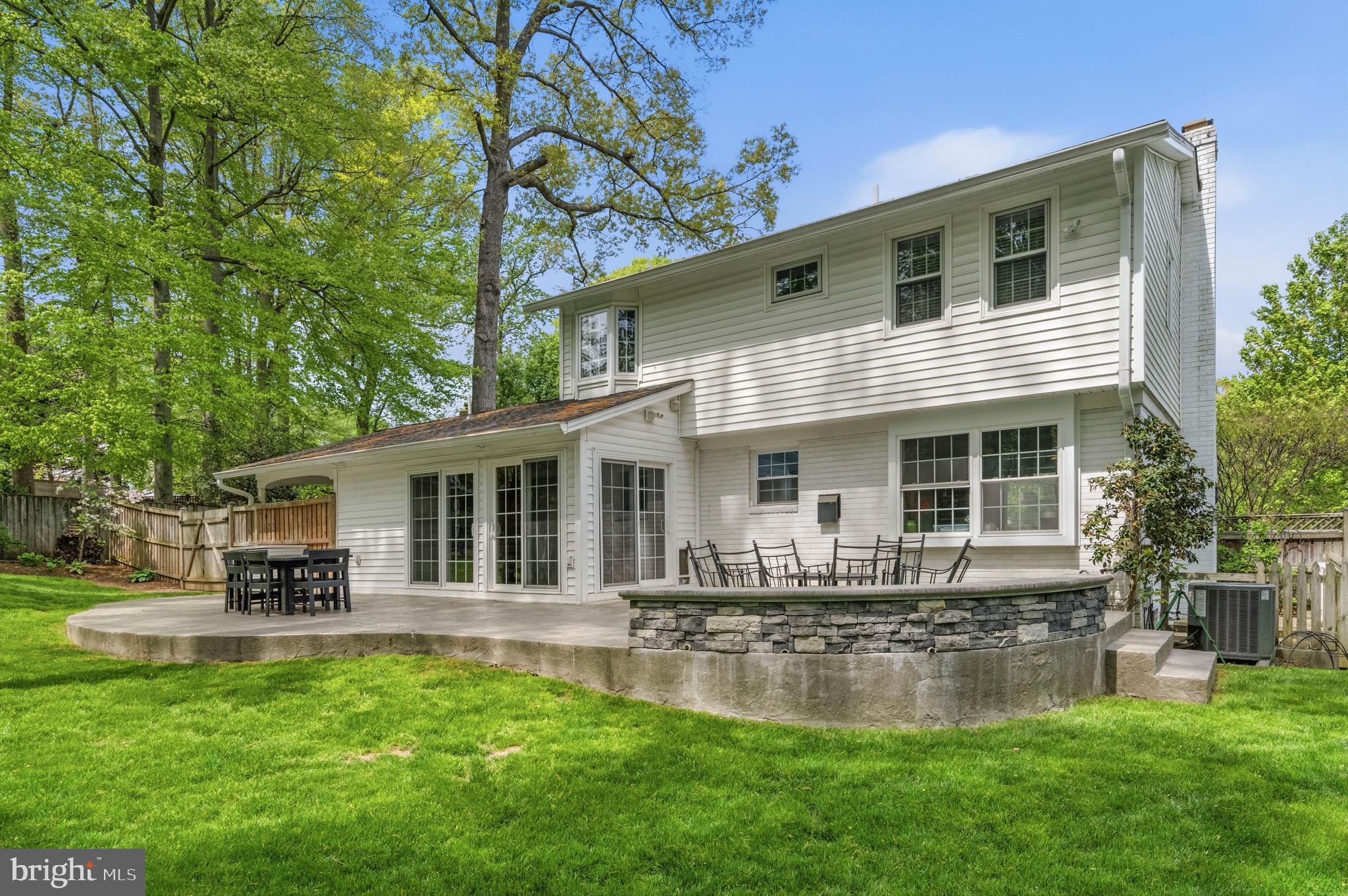 8927 Cromwell Drive Springfield, VA 22151 - Photo 8 of 20 a front view of house with a garden and patio