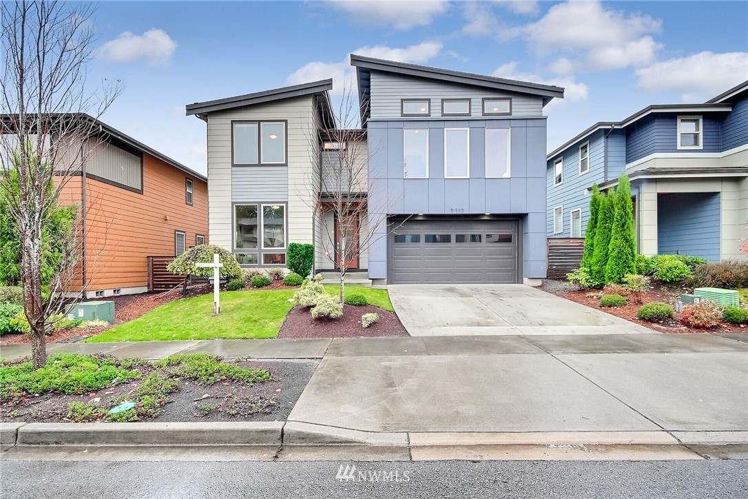 5113 Northeast 11th Place Renton, WA 98059 - Photo 1 of 40 a front view of a house with garden
