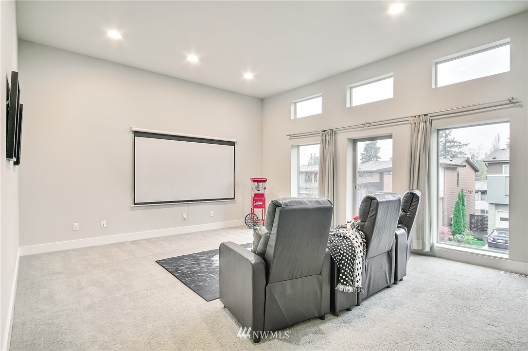 5113 Northeast 11th Place Renton, WA 98059 - Photo 17 of 40 a living room with furniture and large windows