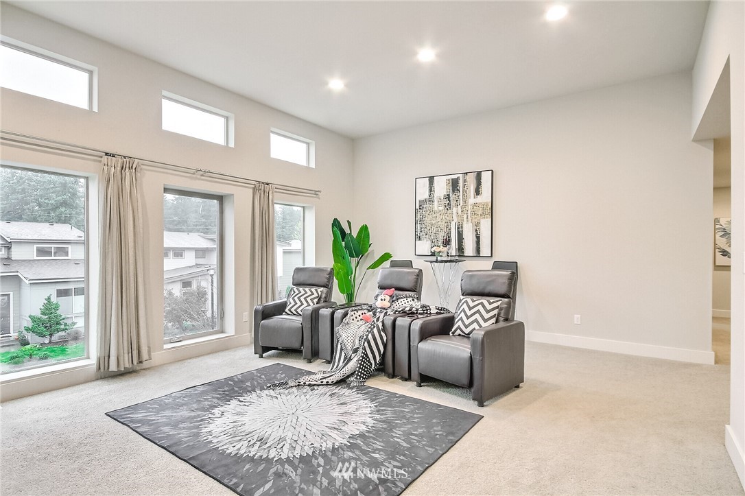 5113 Northeast 11th Place Renton, WA 98059 - Photo 18 of 40 a living room with furniture and a potted plant