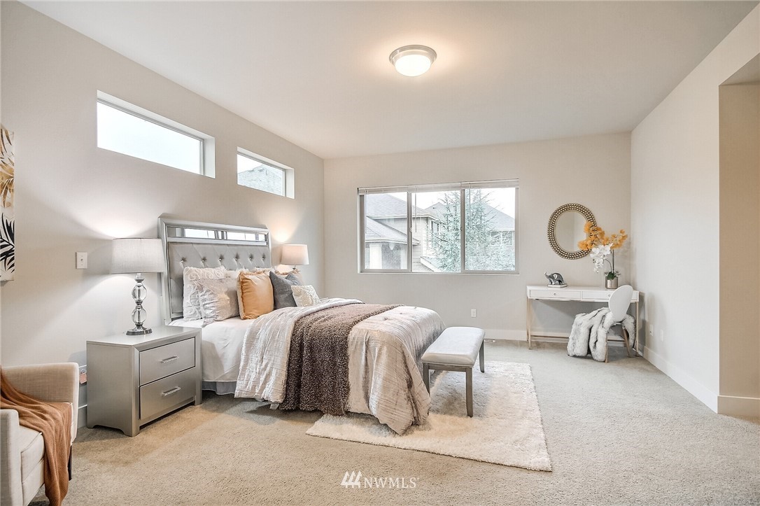 5113 Northeast 11th Place Renton, WA 98059 - Photo 20 of 40 a bedroom with bed and window