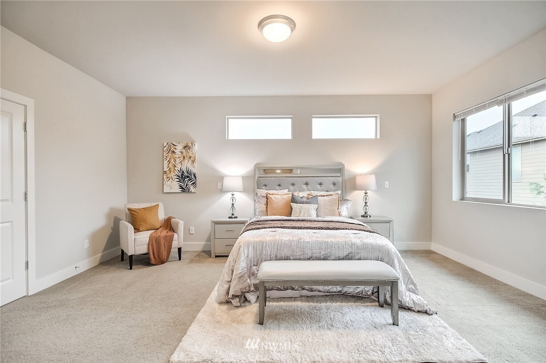 5113 Northeast 11th Place Renton, WA 98059 - Photo 21 of 40 a bedroom with a bed and window
