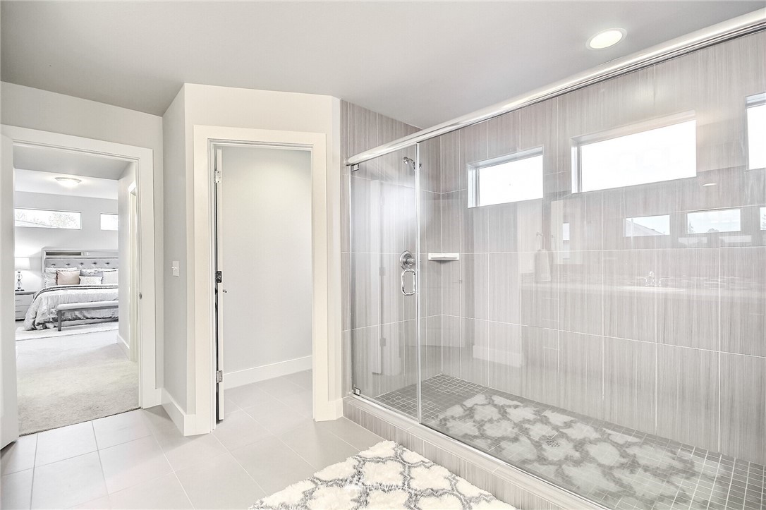 5113 Northeast 11th Place Renton, WA 98059 - Photo 25 of 40 a bathroom with a glass shower door