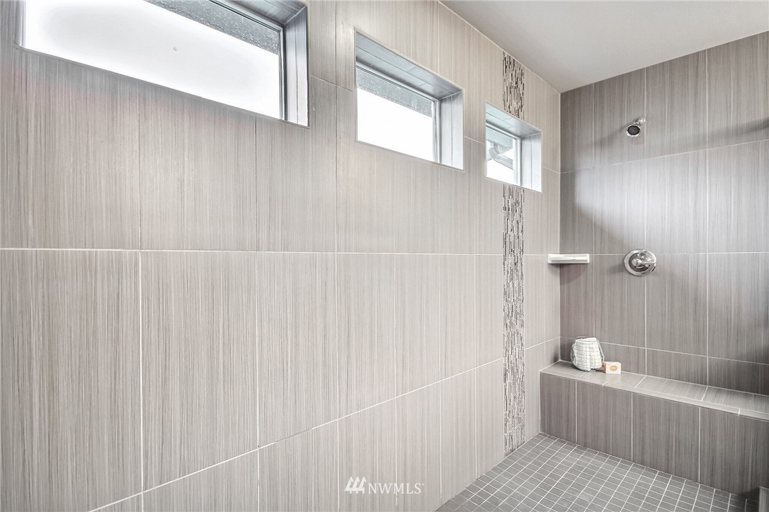 5113 Northeast 11th Place Renton, WA 98059 - Photo 26 of 40 a bathroom with a bathtub and shower