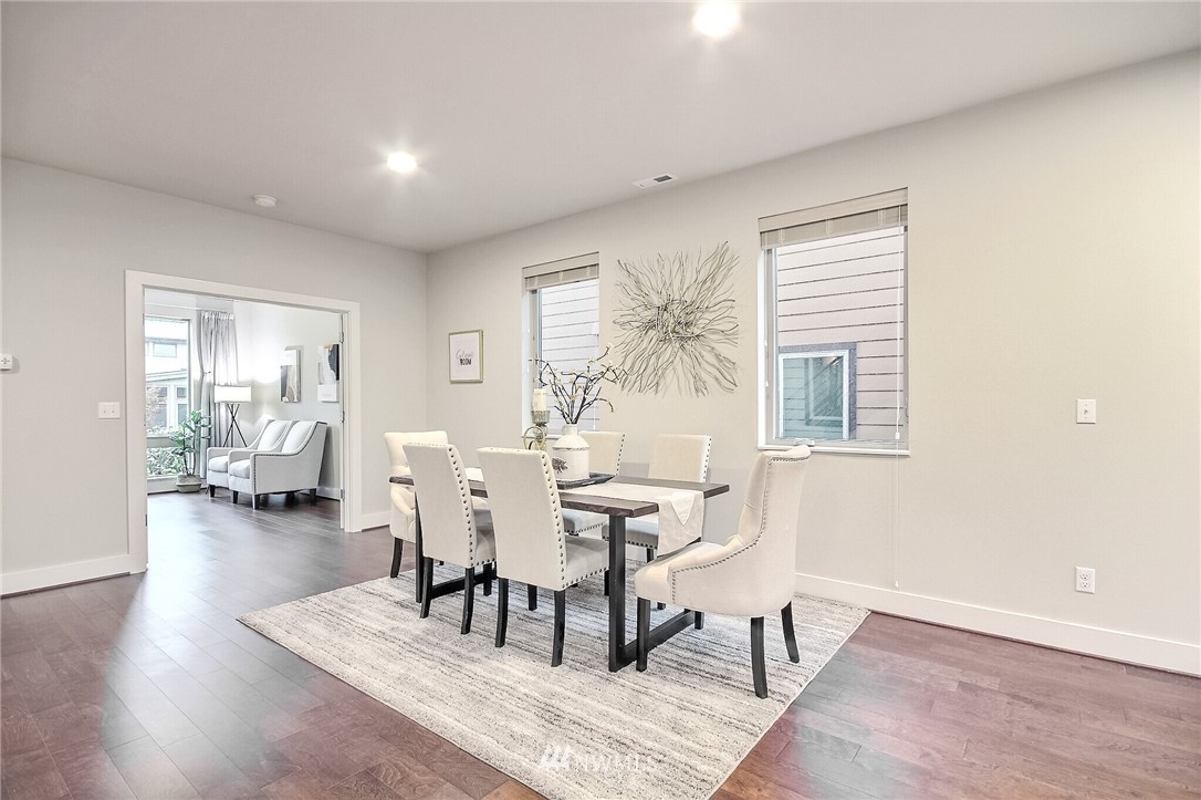 5113 Northeast 11th Place Renton, WA 98059 - Photo 10 of 40 a living room with furniture and wooden floor