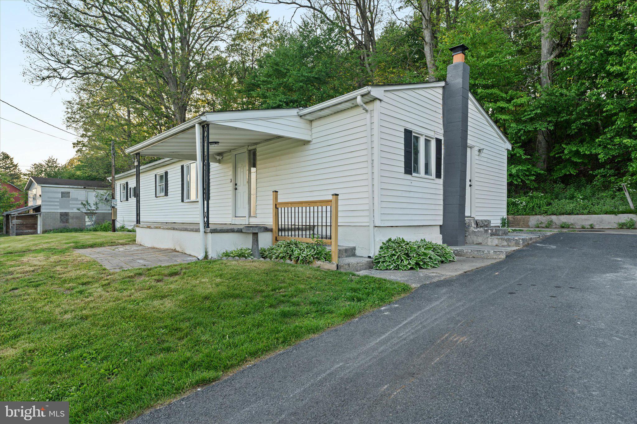 831 Deturksville Road Pine Grove, PA 17963 - Photo 2 of 24 a view of a house with backyard and garden
